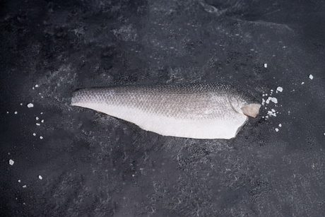 Fish fillet on a dark surface