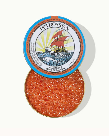 Petrossian salmon roe container with blue lid on a white background