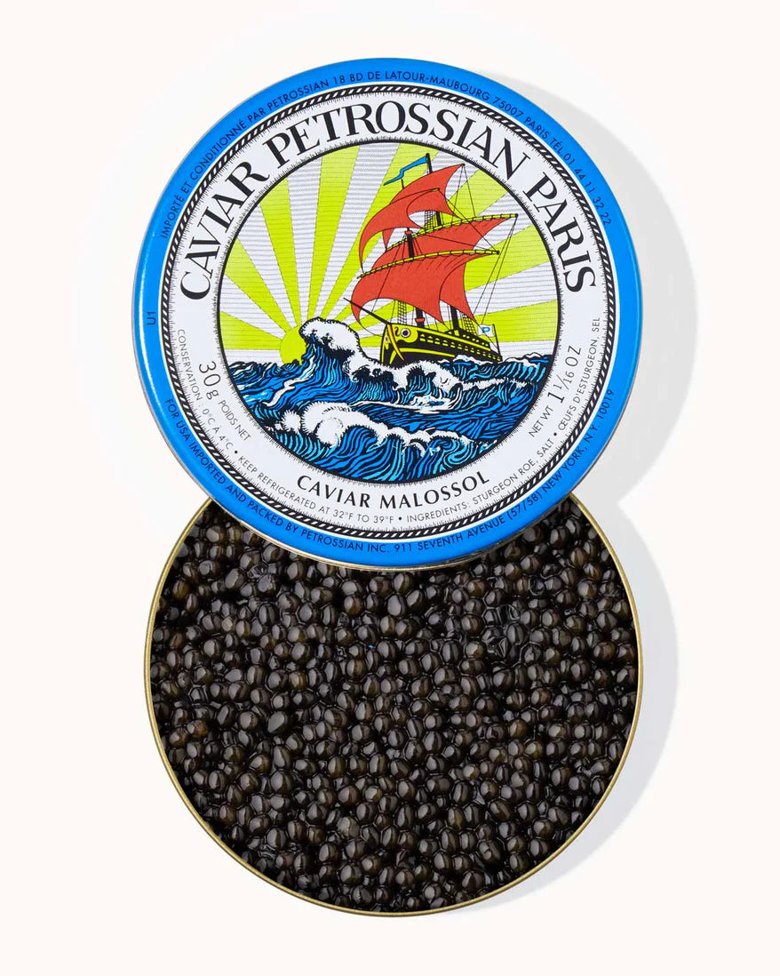 Caviar Petrossian Paris caviar in a tin with a decorative lid.