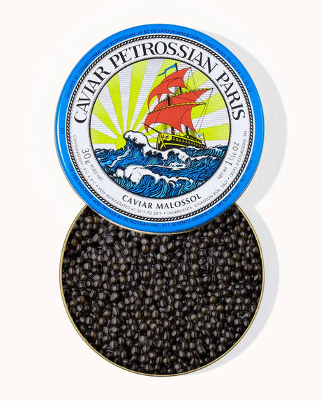 Caviar Petrossian Paris caviar in a tin with a decorative lid.